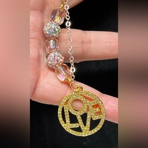 Pretty Swarovski pink and gold link chain bracelet with stunning LOVE charm